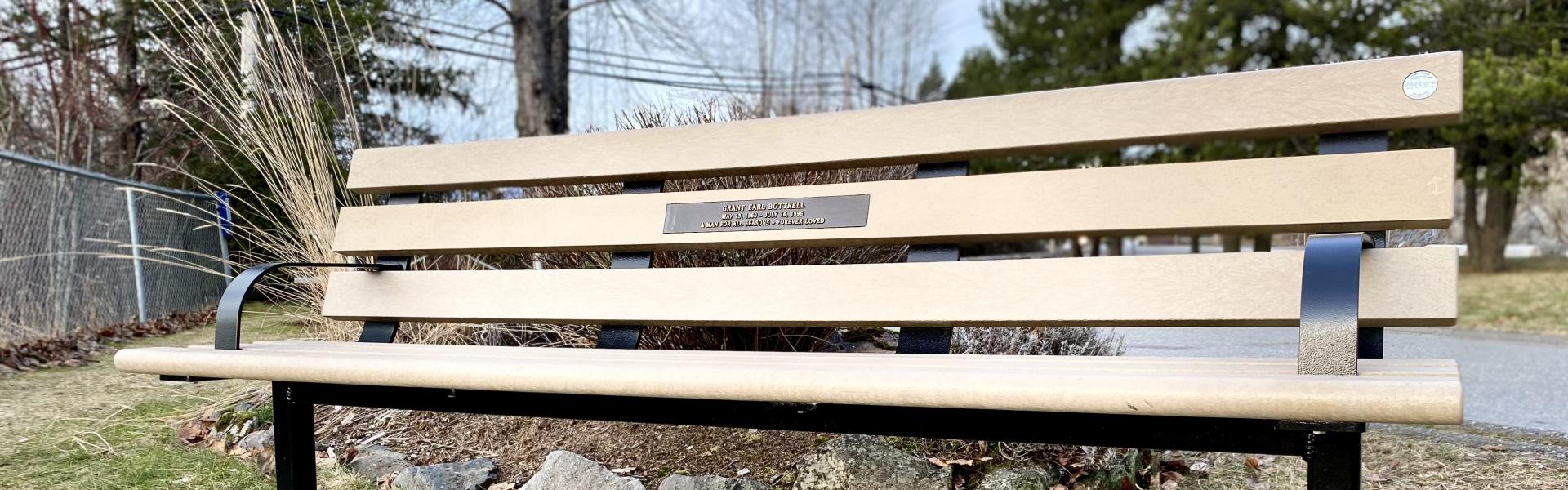 park bench with plaque installed on it