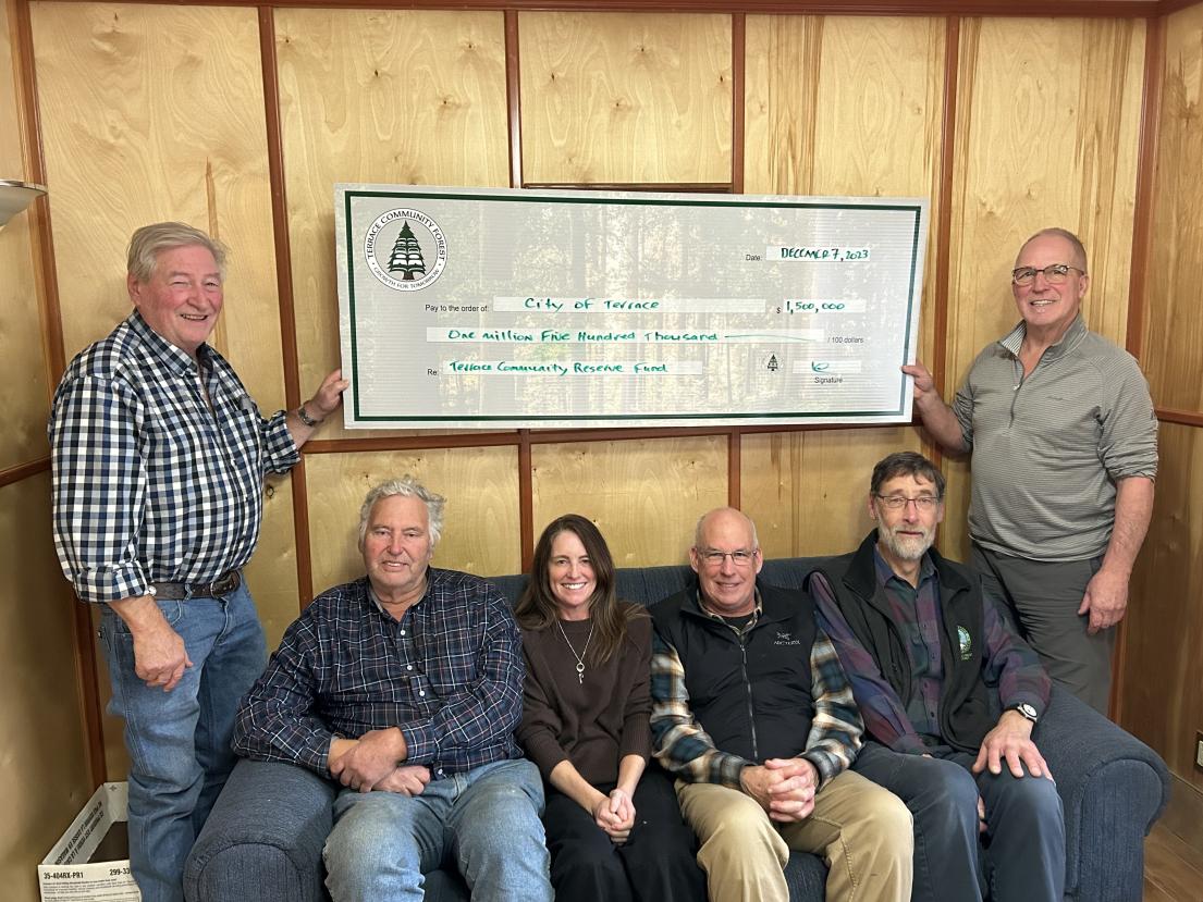 Photo of Board Chair John Nester; Board Member Don Coburn; Board Member Sam Blair; Councillor Dave Gordon; Board Member John Perras; and General Manager Kim Haworth. They're holding up an oversized cheque for $1.5 million.