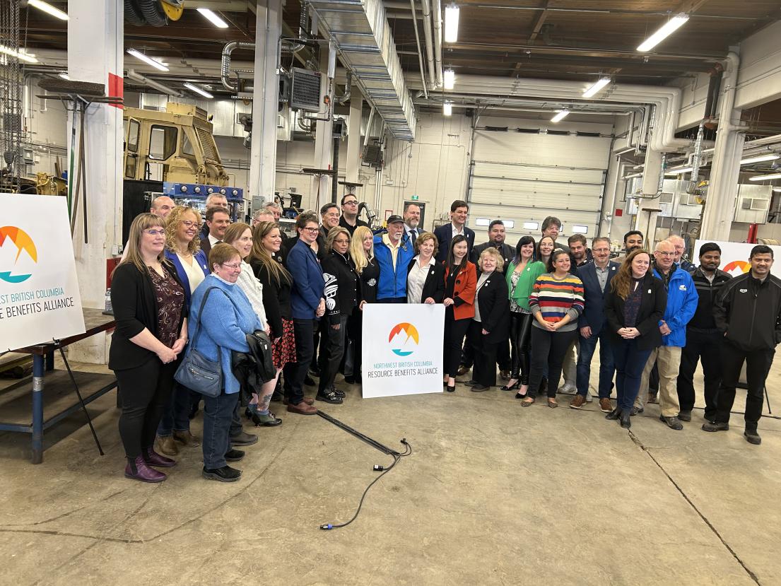 On March 15, 2024, in Terrace at Coast Mountain College, Premier David Eby, Minister Anne Kang, and a collection of present and past Northwest BC Resource Benefits Alliance representatives and mayors/councillors get in a group shot celebrating the provincial government funding received