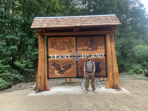 Wood-carved Ferry Island sign